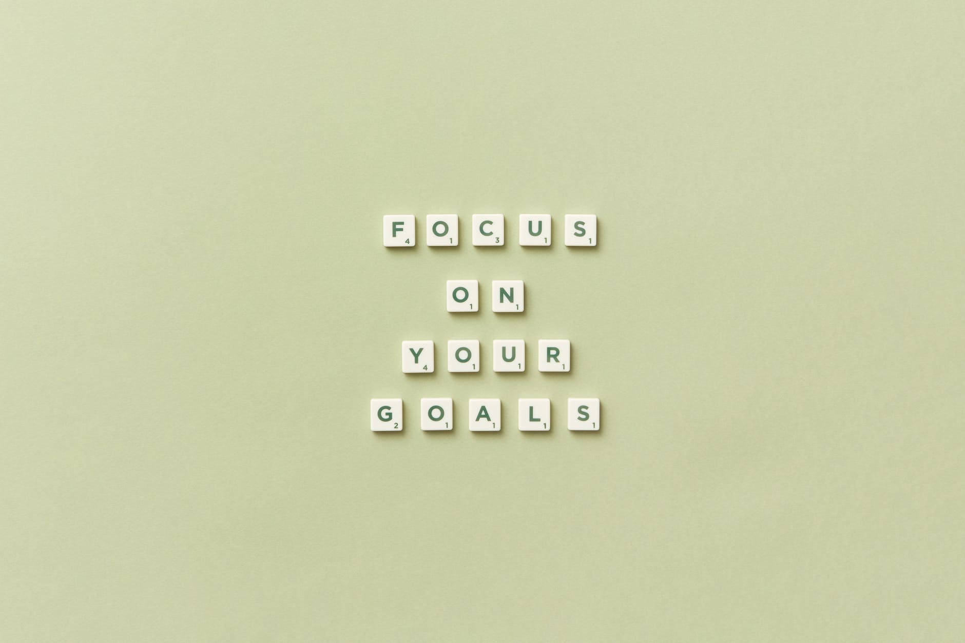 sentence focus on your goals arranged with scrabble tiles