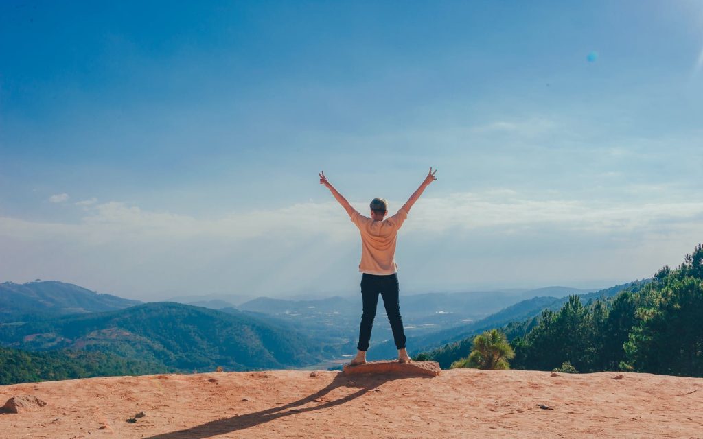 woman standing on cliff